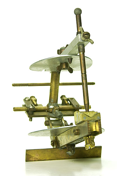  Anterior view of the maxillary member has a central post attached to a horizontal bar that slides freely on a horizontal guide plate of 45 degrees