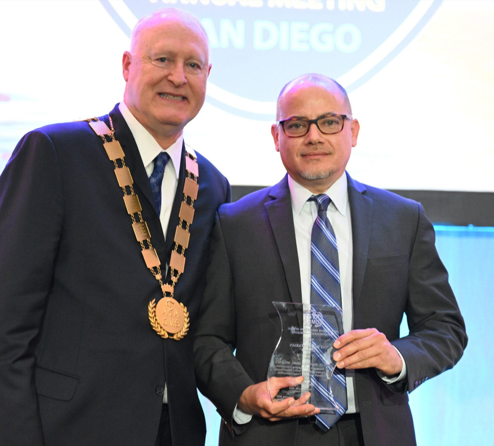 Dr. Jose M. Marchena (right) presented the 2023 Humanitarian Award for Fellows and Members by American Association for Oral and Maxillofacial Surgeons 2022-23 President, Dr. Paul J. Schwartz. Photo courtesy of AAOMS.