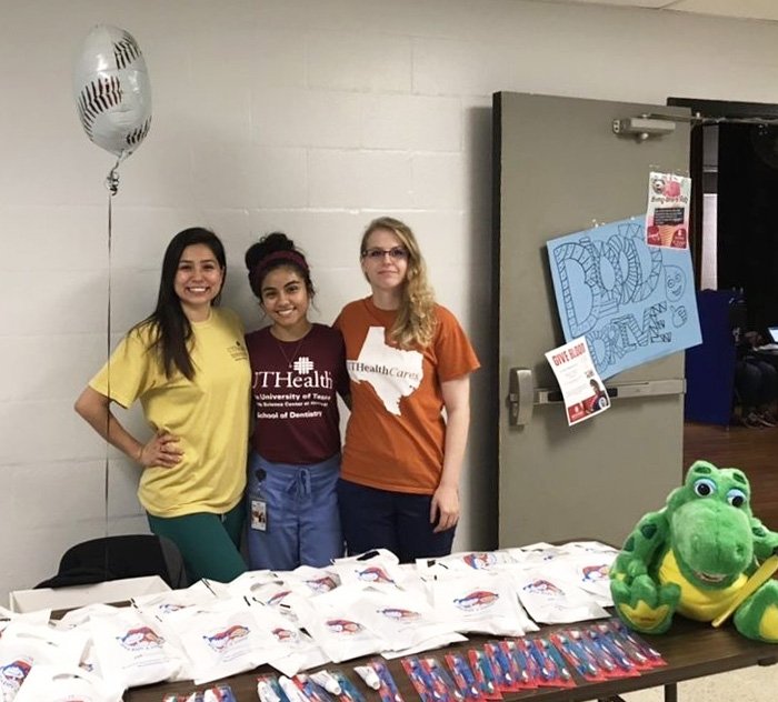 UTHealth students Jennifer Flores, Joceylin Duarte and Casandra Barnes are among 11 HSDA members who volunteered at back-to-school events in the Houston area.