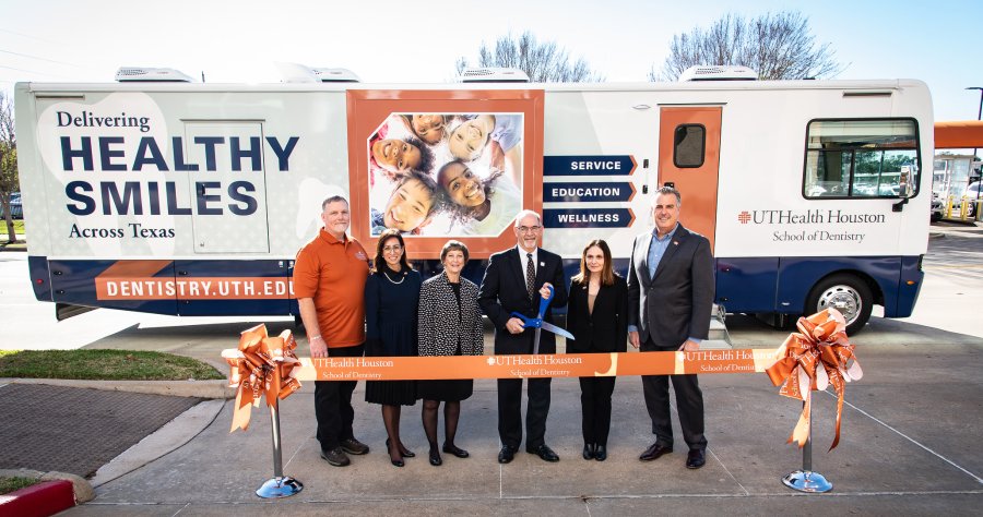Members of the Mobile Dental Van Program, the Office of Patient Care, School of Dentistry and UTHealth Houston leadership for a ribbon cutting ceremony of the new van.