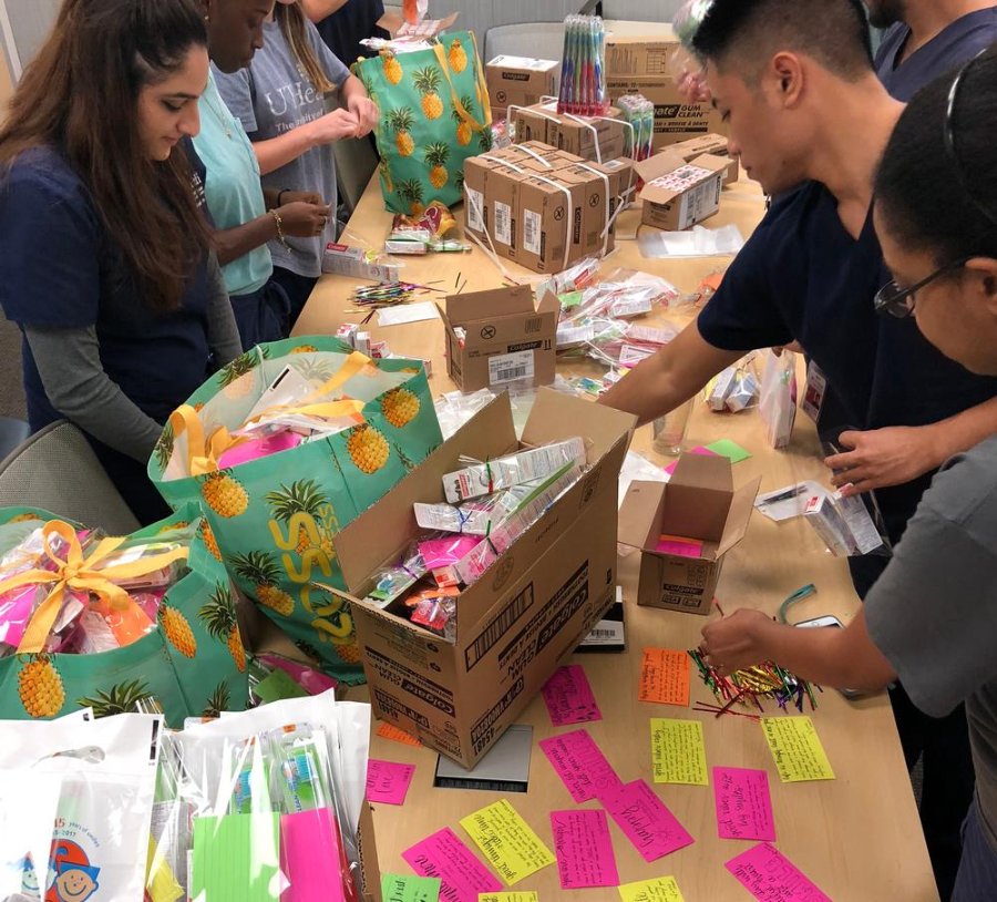 One of the first service Xi Psi Phi service projects had members and volunteers assembling care packs for the homeless.