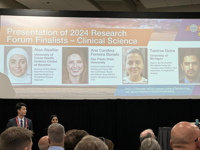 Award winners names and head shots appear on a projected graphic and a large event.