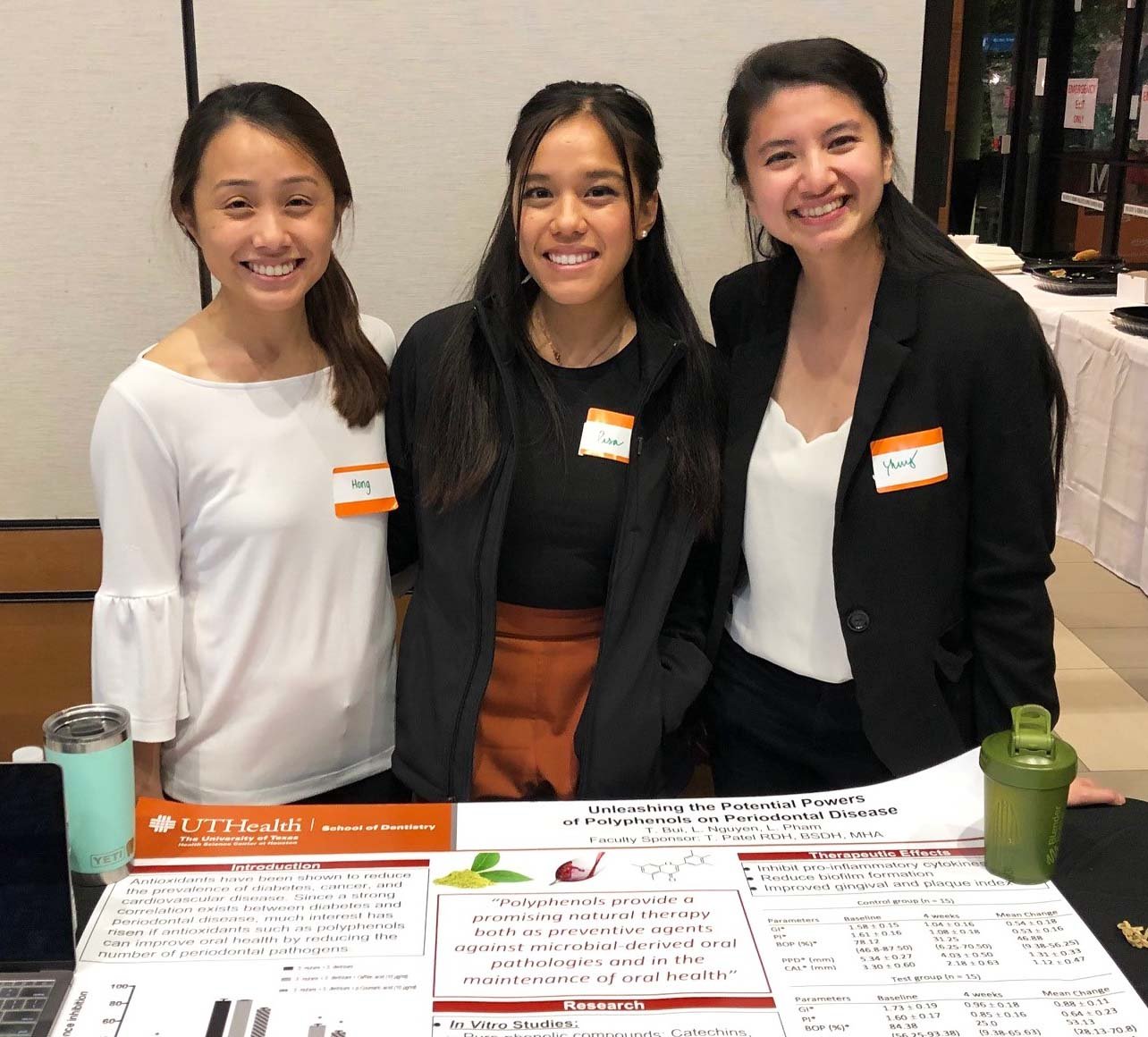 From left are Lac-Hong Pham, Lisa Nguyen, and Thuy Bui, who tied for second place in the GHDHS scientific poster competition.