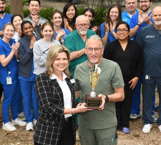 Oran Practice Director Stephen Laman, DDS (right), accepts the UTHealth Houston School of Dentistry Digital Dentistry Practice of the Year trophy.