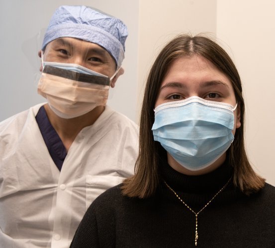 Photo of Grace Moss with James Melville, DDS. Melville reconstructed Grace's jaw using tissue engineering. (Photo by Rogelio Castro/UTHealth)