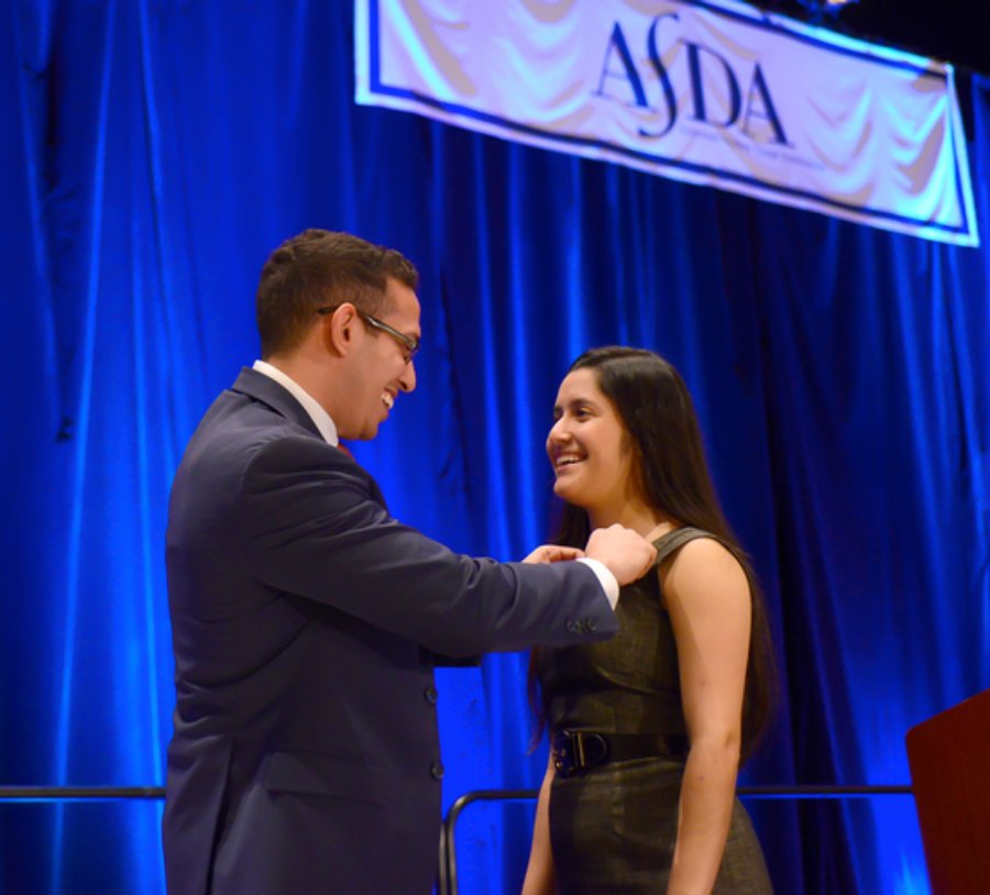 Dr. Tanya Sue Maestas (right) receiving an award at ASDA Annual Session as a student at UTHealth Houston School of Dentistry.