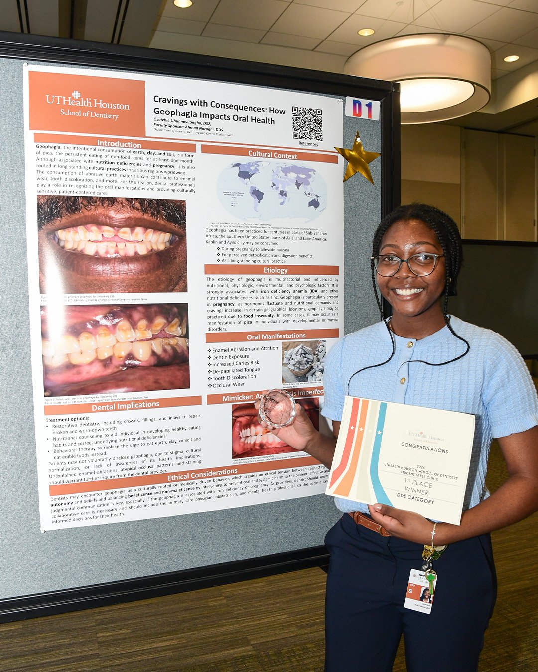 Individual stands beside a research poster while holding a certificate.