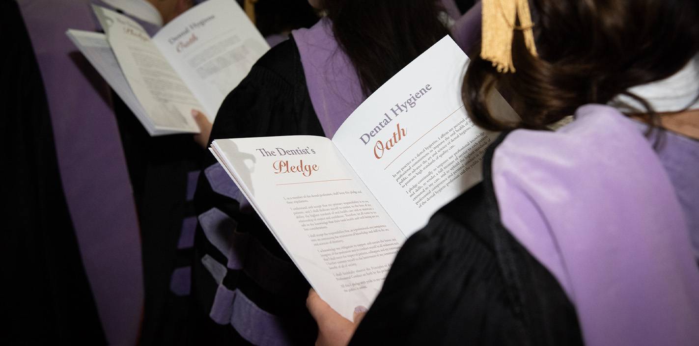 Over-the-shoulder view of commencement program.