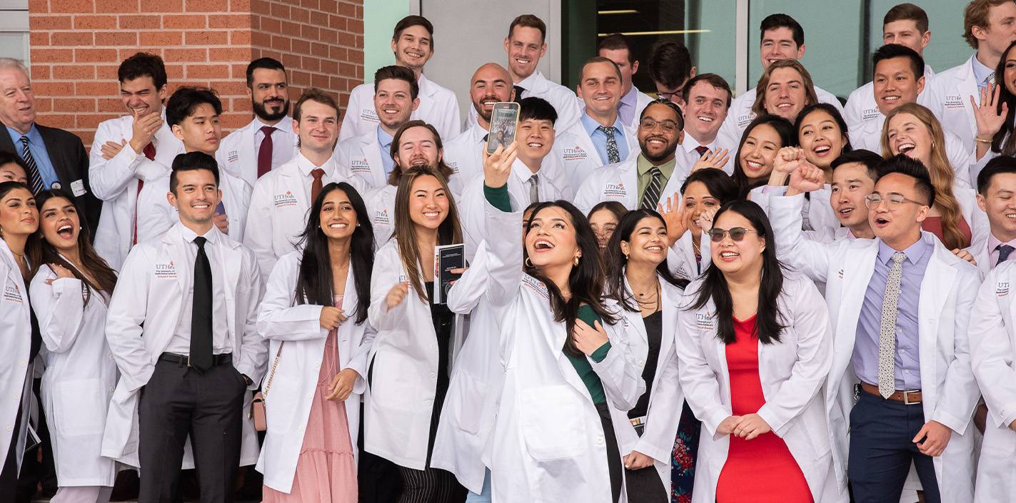 Second-year students from the Dental Class of 2025 celebrate their entrance into the health care profession after the 24th Annual DDS White Coat Ceremony.