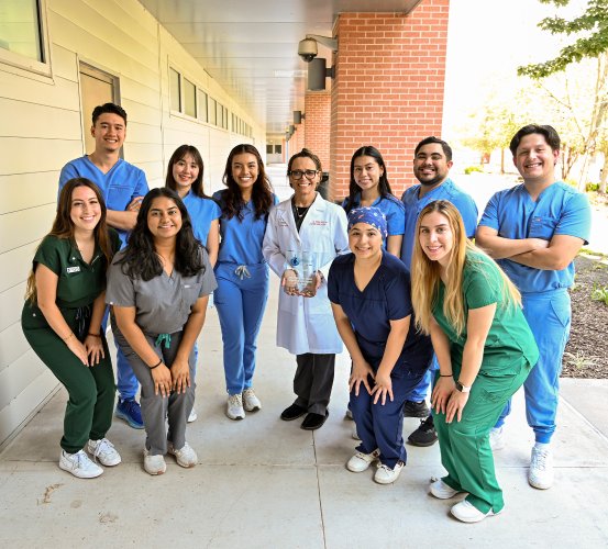 Group photos of dental students and a faculty member holding an award.