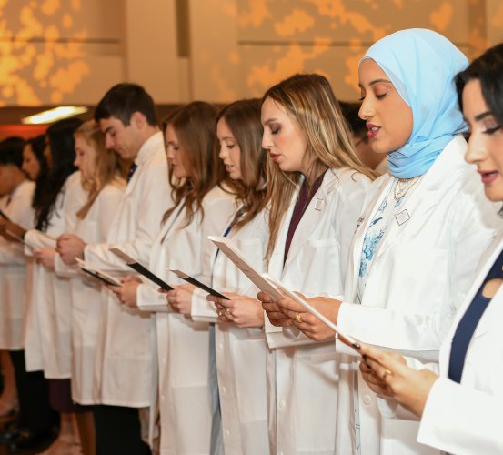 Members of the UTHealth Houston School of Dentistry DDS Class of 2026 read The Dentist’s Pledge.