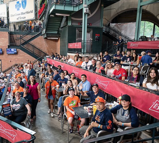 UTHealth Houston School of Dentistry alumni, employees, and guests pose for a group photo on the Brew House Deck.