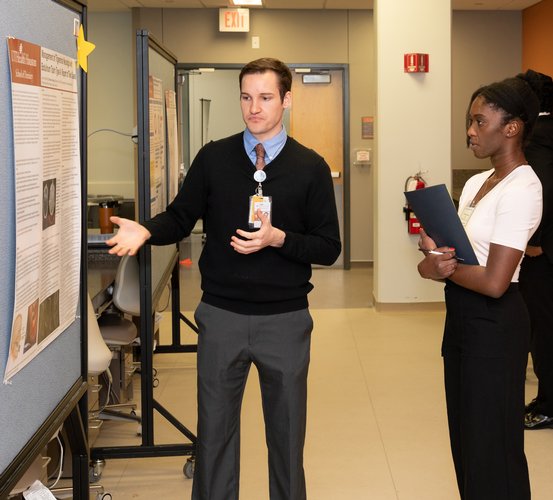 First-year dental student Brendan Moxley presents during the 2023 Student Scientific Table Clinic.