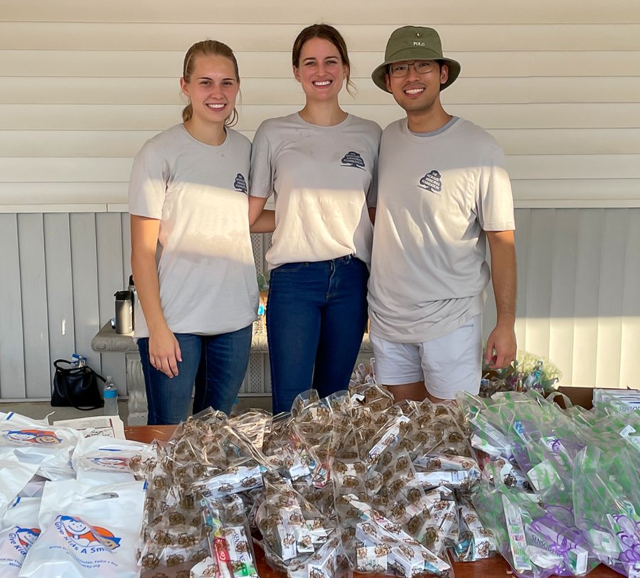 Third-year dental students (from left to right) Kayla Rankin, Elizabeth Pohlmann, and Khoi Le volunteered at the Morales Memorial Foundation’s 24th Annual School Supply Giveaway.