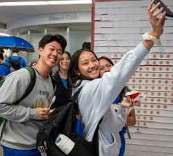 Group of students pose for a selfie.