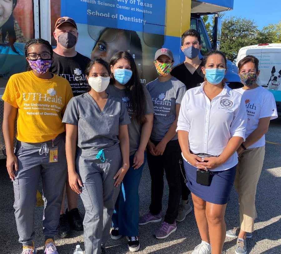 Distribution volunteers (from left) were Dominque Angibeau, Pat Henshaw, Dara Meghna, Carolina Rangel, Dr. Sophia Saeed, Diego Rivas, State Rep. Christina Morales, and Dr. Margo Melchor.