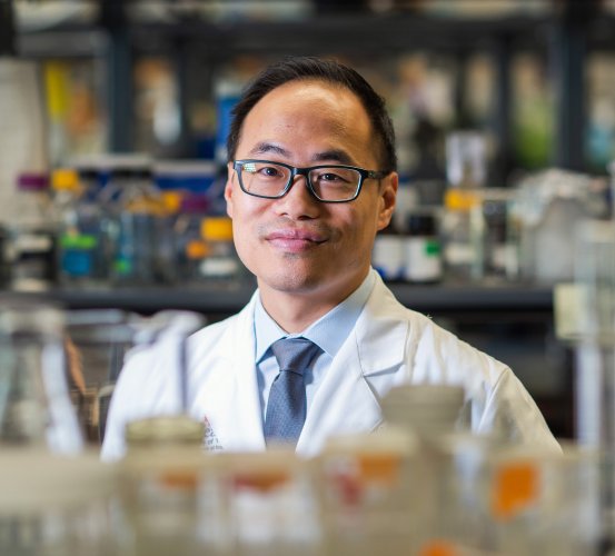 Dr. Simon Young stands in his laboratory.