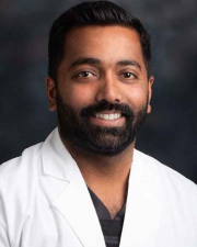 Dr. Navin Pathiyil, DMD, FICOI, DICOI
