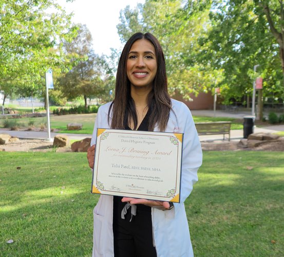 Associate Professor Tulsi Patel, RDH, MHA, holders her certificate for the Lorna J. Bruning Award for Outstanding Teaching.