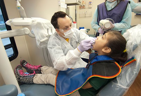 Resident working on a pediatric patient