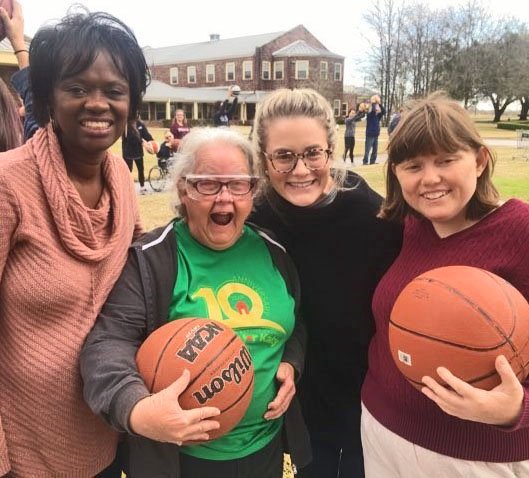 Associate Dean Lisa Cain, PhD, (left) and dental student Laura Santo Salvos were among the UTSD volunteers at Brookwood during UTSD’s Diversity and Inclusion Week.