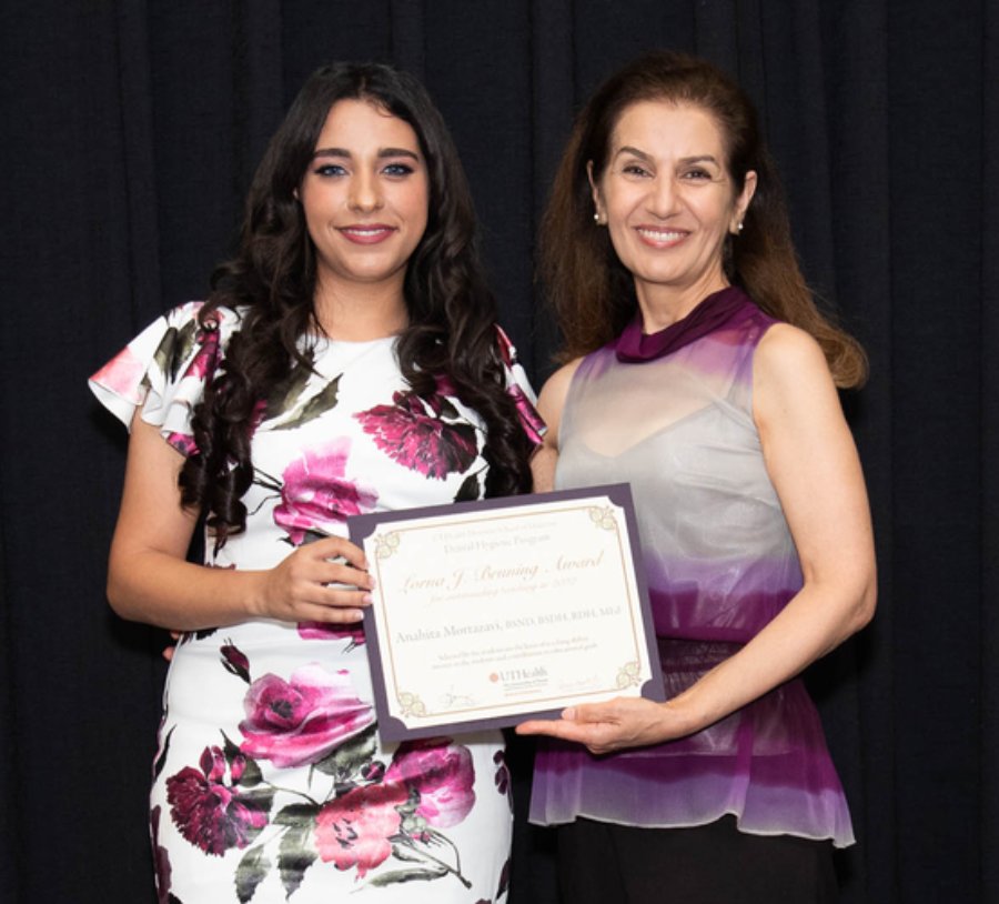 Clinical Assistant Professor Anahita Mortazavi, RDH (right), accepts her Lorna J. Bruning Outstanding Teaching Award during the 2022 DH Awards from Dental Hygiene 2022 Class President Reham Abuabeileh.