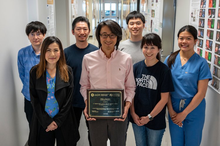 Large group photo holding an award.