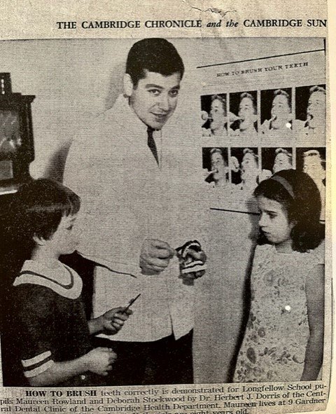 Newspaper clipping of Dr. Herbert Dorris demonstrating how to properly brush teeth. Photo courtesy of Dr. Wayne Dorris.