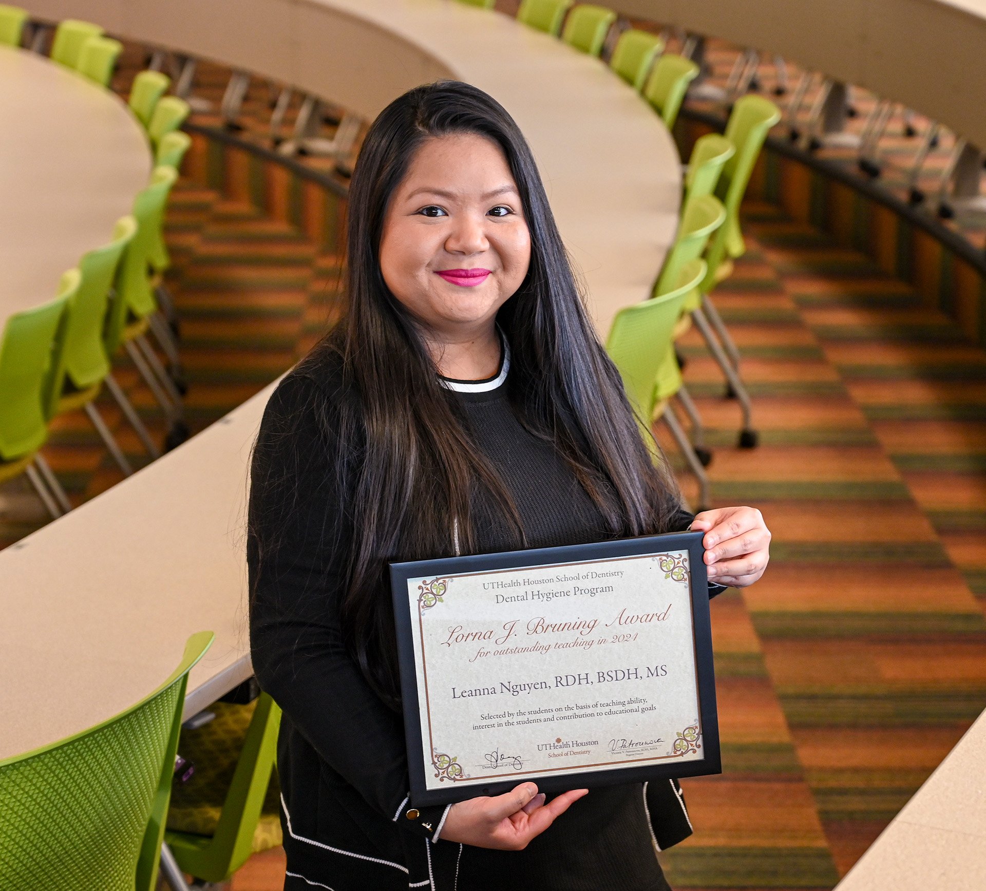 Assistant Professor Leanna Nguyen, RDH, BSDH, MS, holds her certificate for the Lorna J. Bruning Award for Outstanding Teaching.