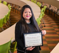 Associate Professor Leanna Nguyen, RDH, BSDH, MS, holds her certificate for the Lorna J. Bruning Award for Outstanding Teaching.