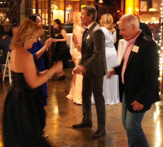 People dancing at alumni dental prom.