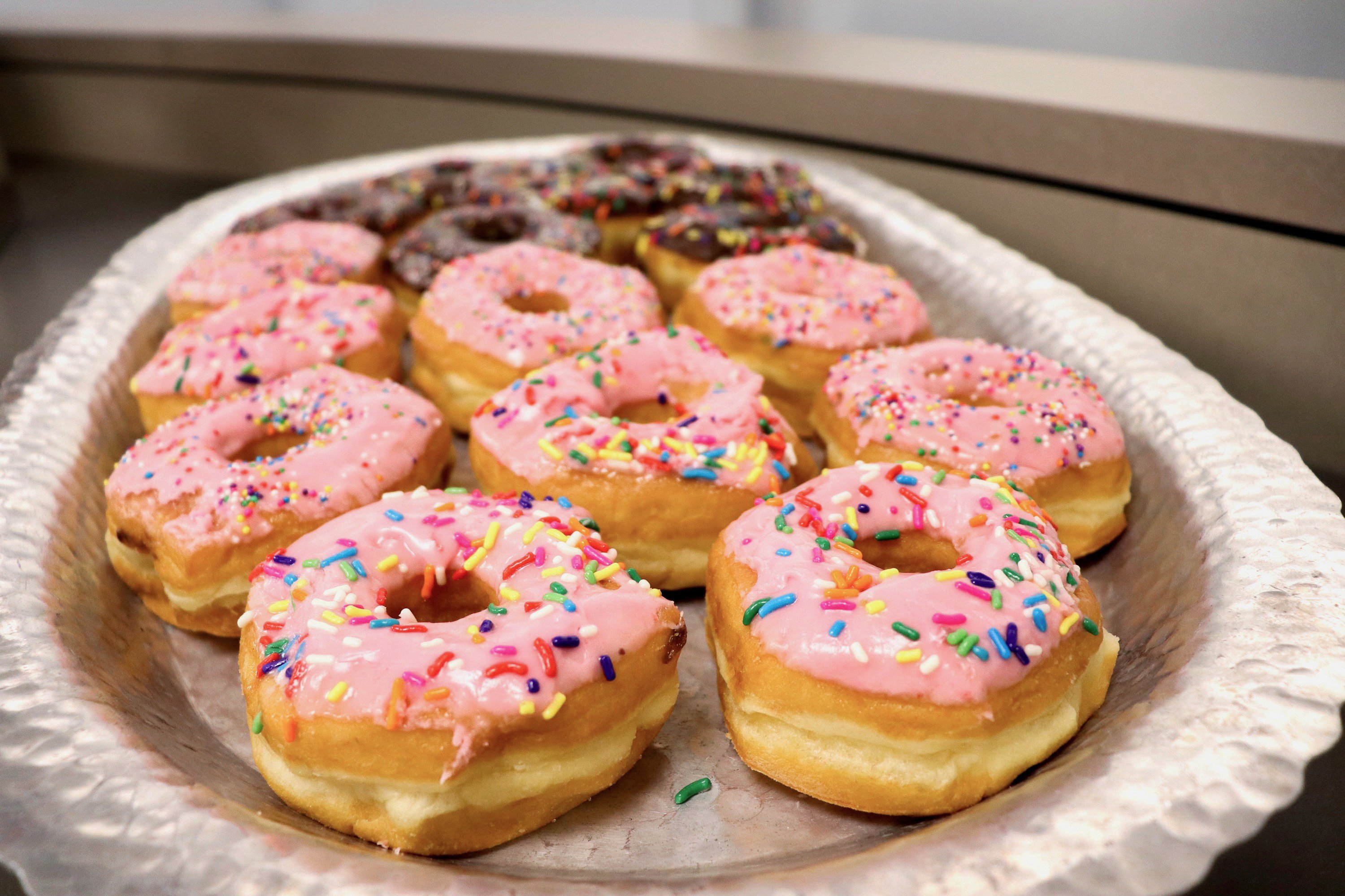 Variations of frosted donuts with sprinkles were available for the attendees.