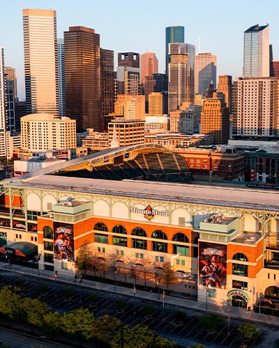 Exterior of Minute Maid Park and the downtown Houston skyline.