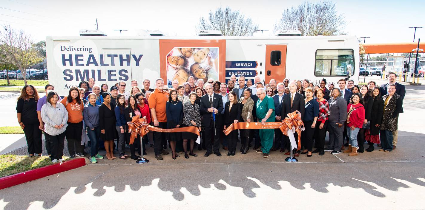 Group photo of the ribbon-cutting ceremony for the UTHealth Houston School of Dentistry's Mobile Dental Van Program