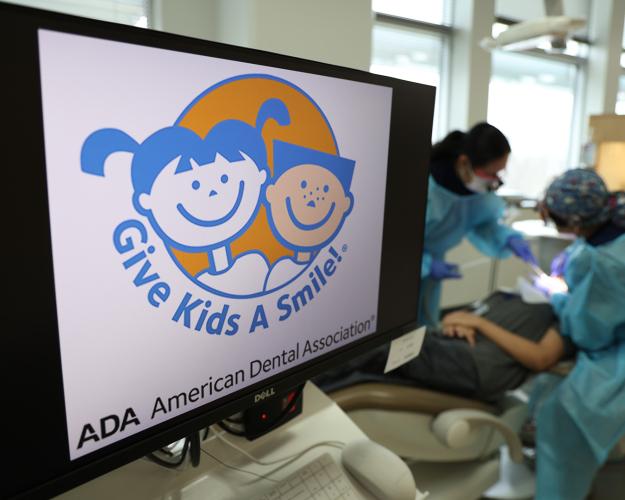 Give Kids A Smile sign on display in the dental clinic.