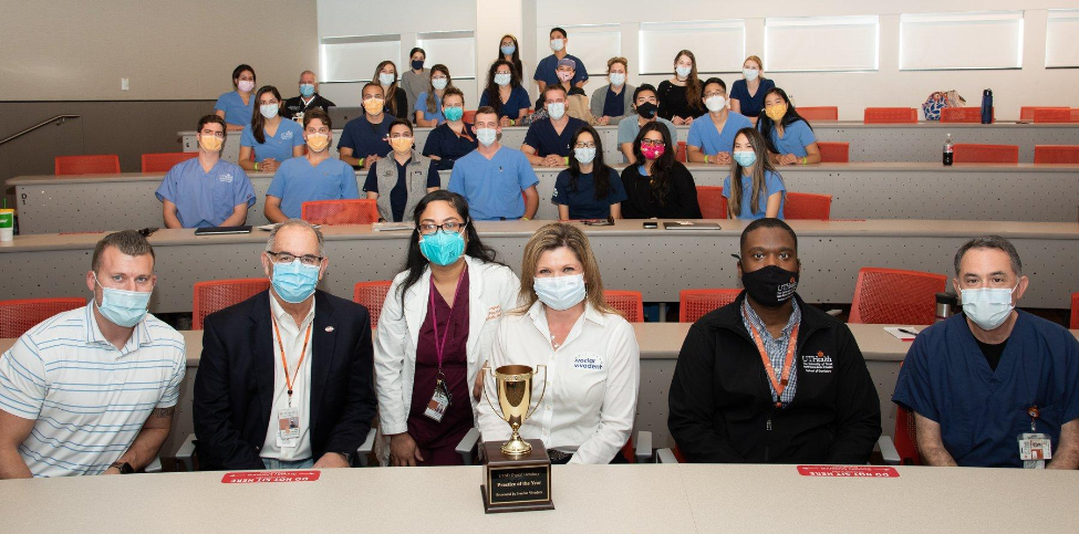 Members of the Orange Practice, Ivoclar Vivadent, and UTSD Dean John Valenza, DDS, and Director of Digital Dentistry Michelle Thompson, DDS, gather for a photo with the Digital Dentistry Practice of the Year trophy.