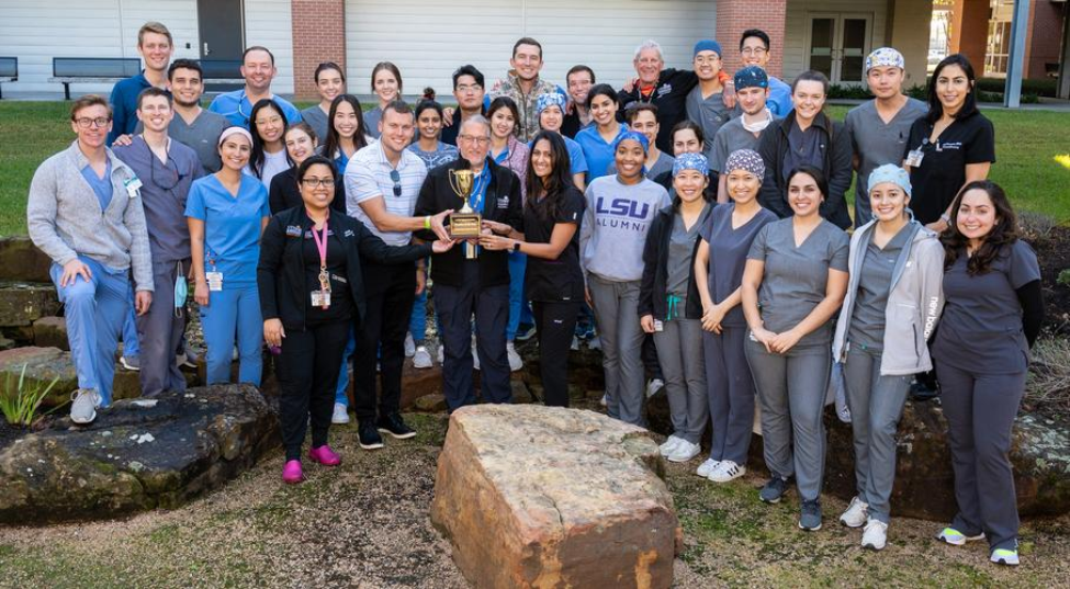 Members of the Orange Practice, Ivoclar Vivadent, and Director of Digital Dentistry Michelle Thompson, DDS, gather for a photo with the Digital Dentistry Practice of the Year trophy.