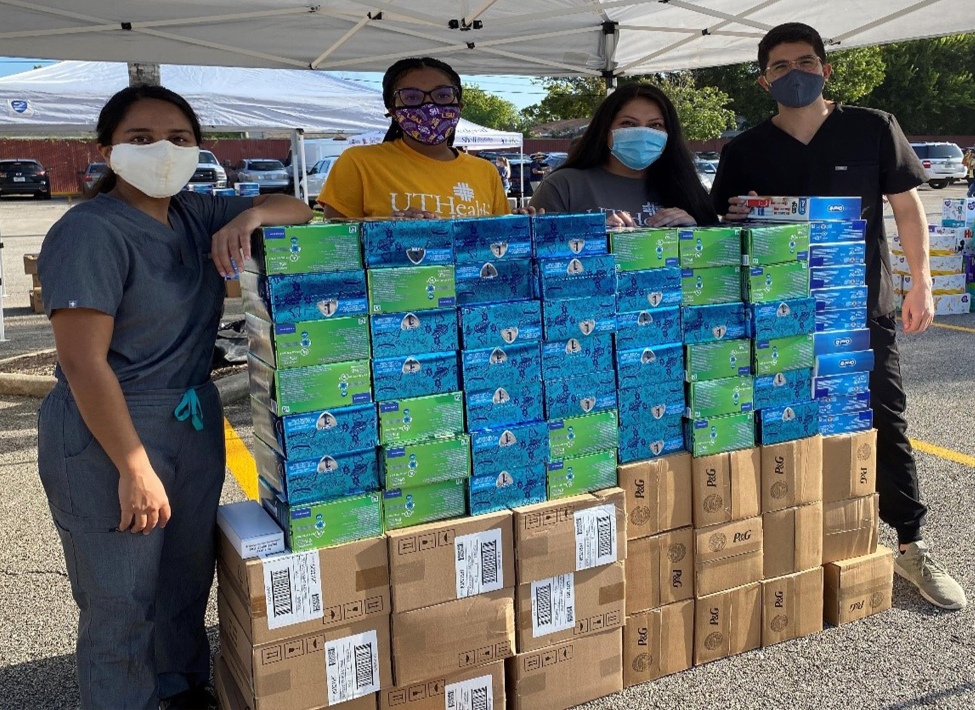 Students (from left) Dara Meghna, Dominque Angibeau, Carolina Rangel and Diego Rivas with a stack of donated toothbrushes by Procter & Gamble. Students (from left) Dara Meghna, Dominque Angibeau, Carolina Rangel and Diego Rivas with a stack of donated toothbrushes by Procter & Gamble.