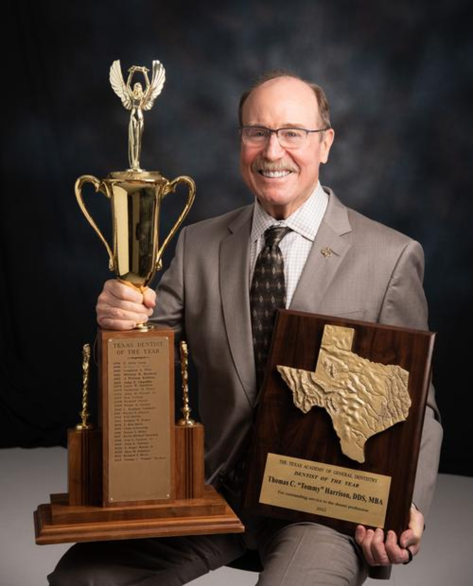 Dr. Tommy Harrison poses with his Texas New Dentist of the Year Award.