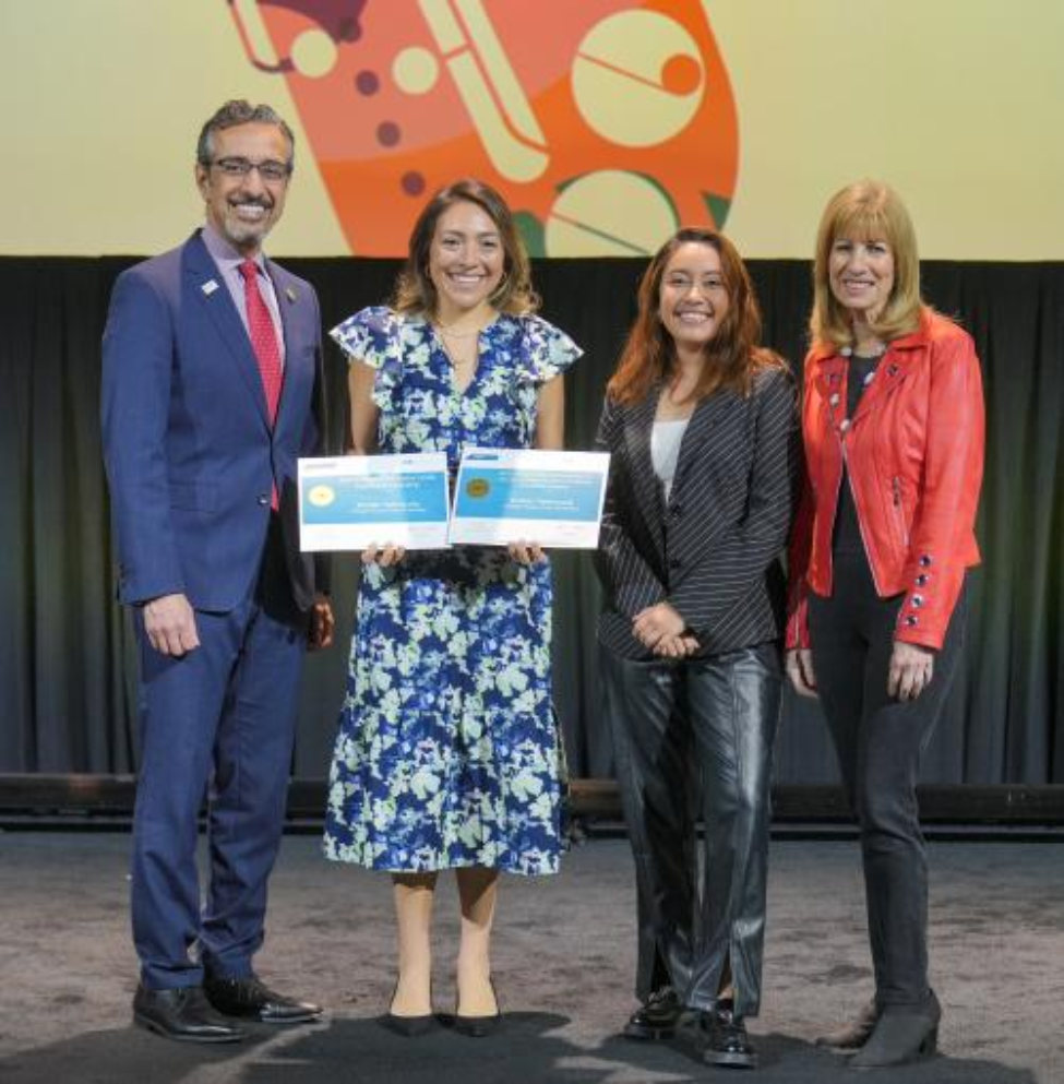 Kristen Valenzuela, a 2020 alumna of UTHealth Houston School of Dentistry, holds the certificates of the two scholarships she received from the American Dental Education Association.