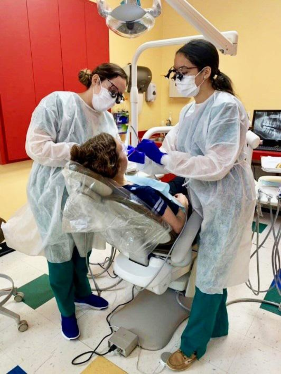 UTHealth students Andrea Garcia (left) and Xochilt Serrano volunteer for Dental Hygiene Day at El Centro de Corazon.