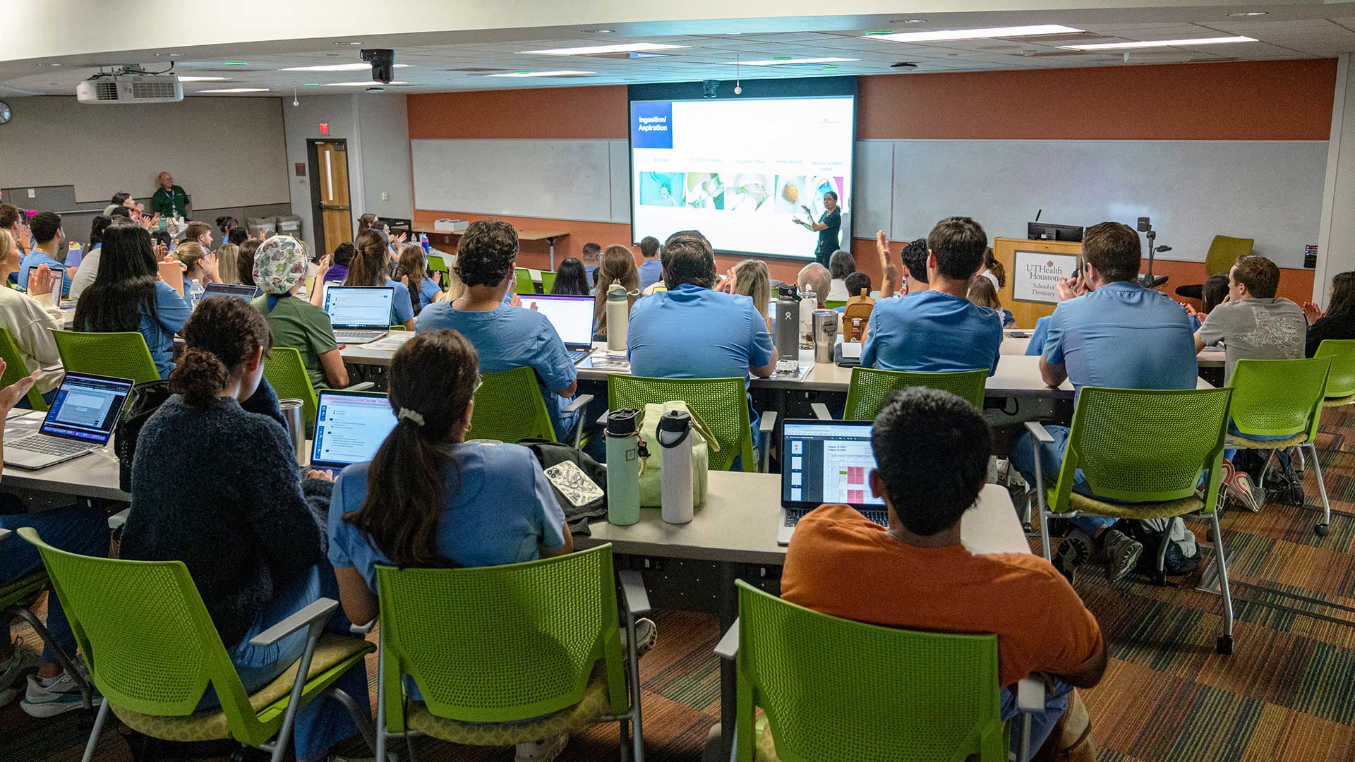 Students at graduation with confetti around them