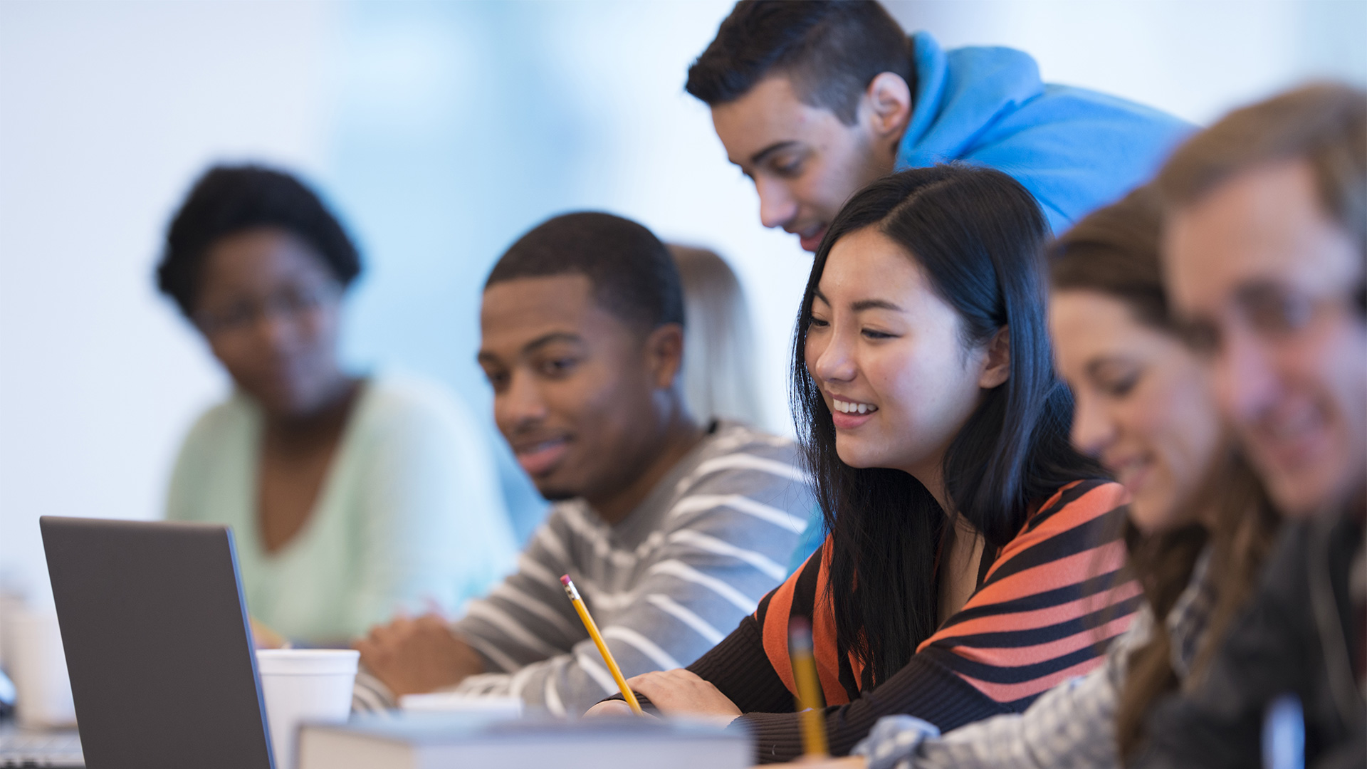 Students looking at a monitor